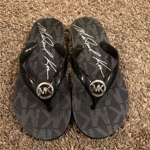 Women’s black Michael kors flip flops